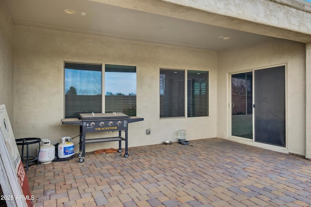view of patio featuring a grill