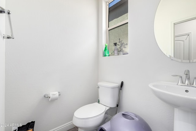 bathroom with sink and toilet