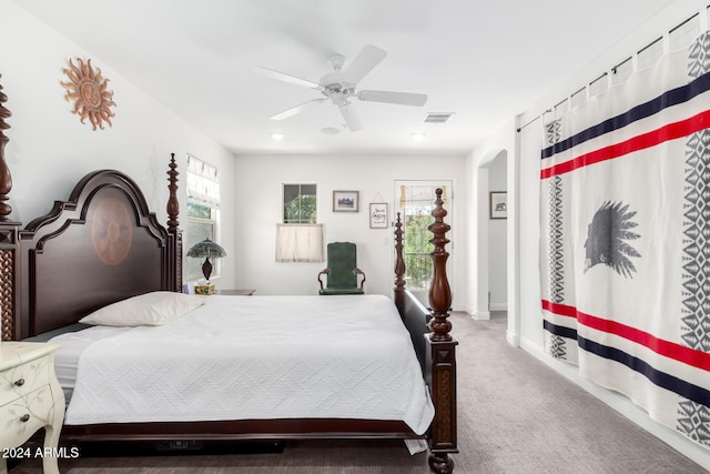 carpeted bedroom featuring ceiling fan