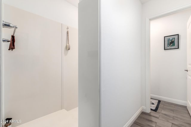 bathroom with wood-type flooring