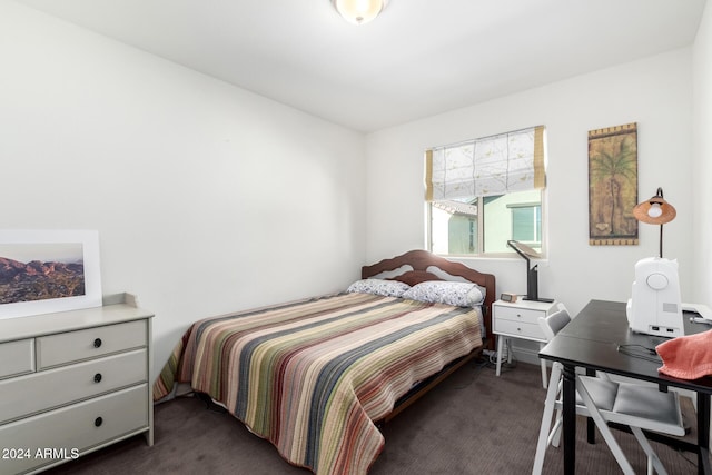 bedroom with dark colored carpet