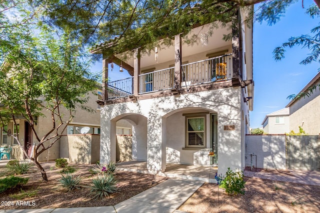 view of front of house with a balcony