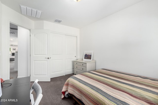 carpeted bedroom featuring a closet