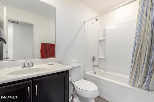 full bathroom featuring shower / tub combo, vanity, and toilet