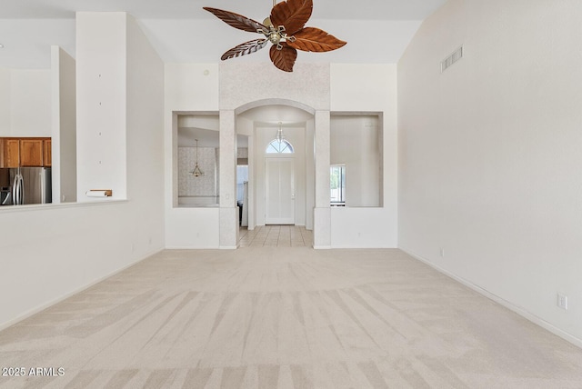 4701 W Fallen Leaf Ln, Glendale, AZ 85310 - unfurnished room featuring arched walkways, a ceiling fan, and light carpet