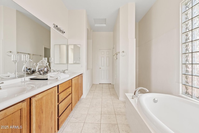 4701 W Fallen Leaf Ln, Glendale, AZ 85310 - full bathroom featuring double vanity, tile patterned floors, and a garden tub