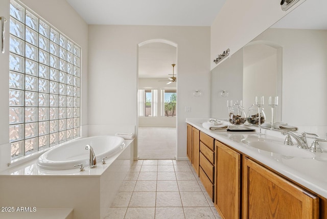 4701 W Fallen Leaf Ln, Glendale, AZ 85310 - bathroom featuring double vanity, a bath, a ceiling fan, and tile patterned flooring