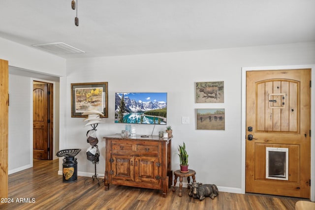 living room with dark hardwood / wood-style flooring