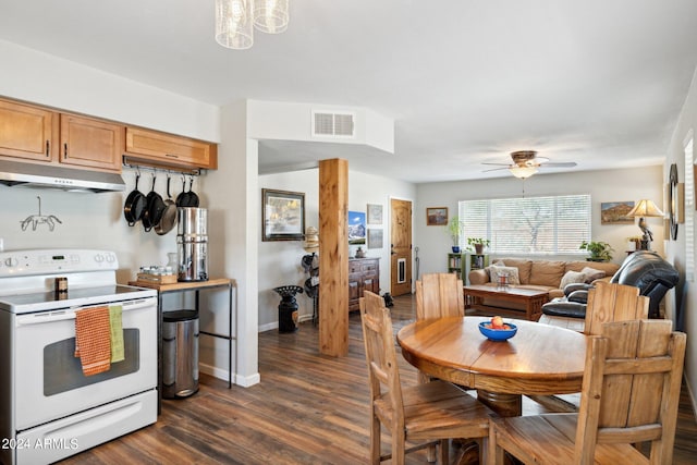 dining room featuring ceiling fan and dark hardwood / wood-style flooring