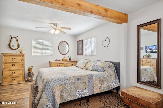 bedroom featuring beam ceiling, hardwood / wood-style flooring, and ceiling fan