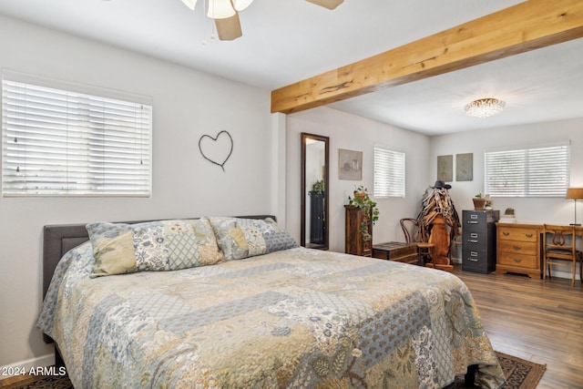 bedroom with beamed ceiling, hardwood / wood-style flooring, and ceiling fan