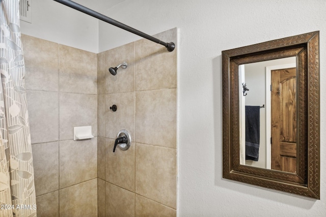 bathroom featuring a shower with curtain