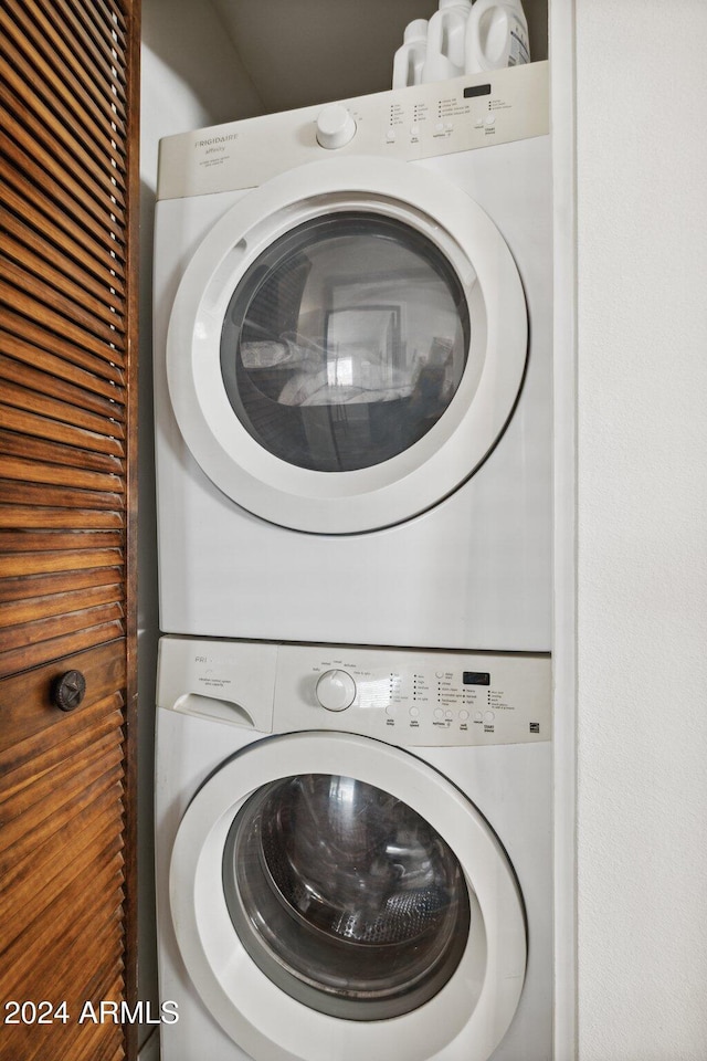 washroom with stacked washer and clothes dryer