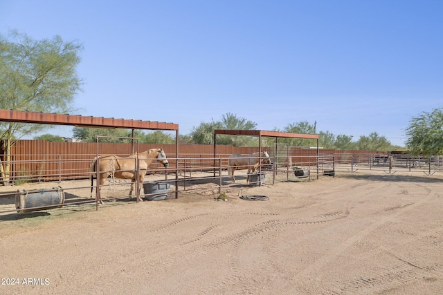 view of yard with an outbuilding and a rural view