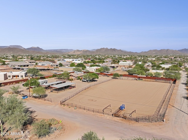 birds eye view of property with a mountain view