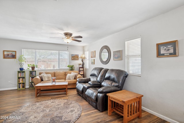 living room with wood-type flooring and ceiling fan