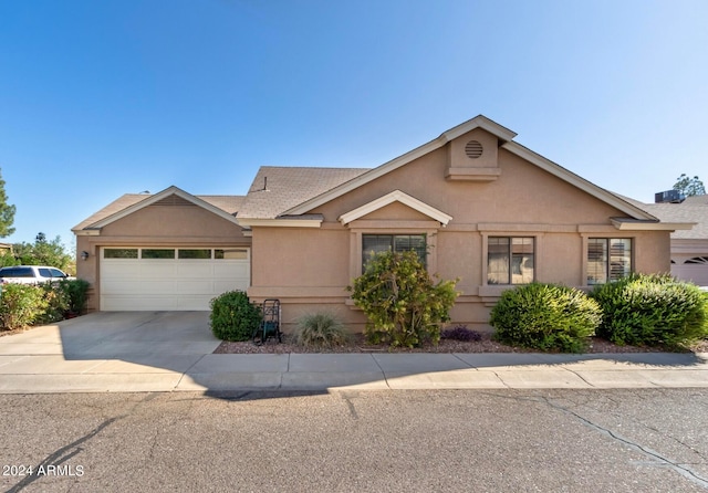 ranch-style home with a garage