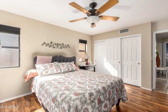 bedroom featuring ceiling fan, a closet, and dark hardwood / wood-style floors