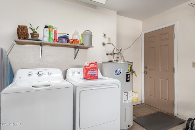 washroom with water heater and separate washer and dryer