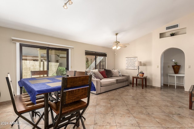 interior space with lofted ceiling and ceiling fan