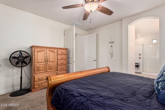 bedroom featuring arched walkways, light carpet, a ceiling fan, visible vents, and baseboards