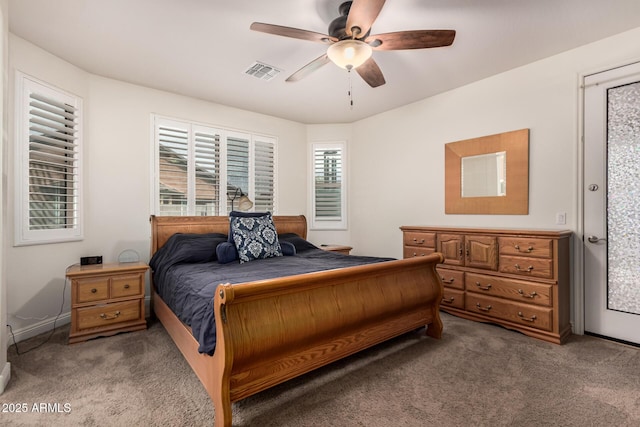 bedroom featuring light carpet, ceiling fan, visible vents, and baseboards