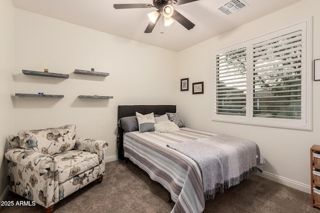 carpeted bedroom with a ceiling fan, visible vents, and baseboards