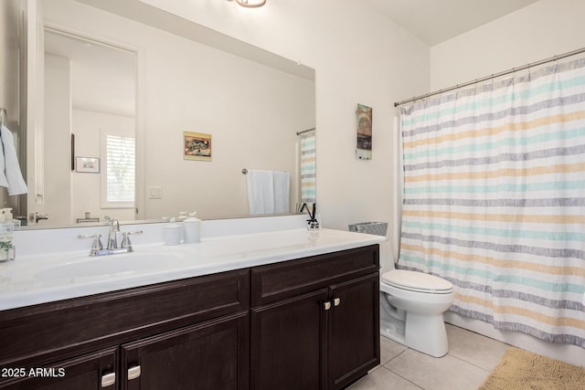 bathroom featuring toilet, a shower with curtain, vanity, and tile patterned floors