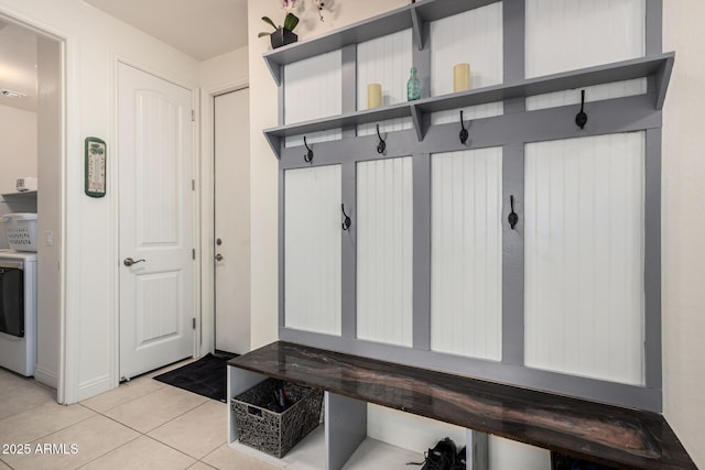 mudroom featuring washer / clothes dryer and light tile patterned floors