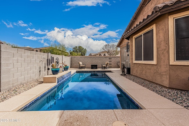 view of pool with a fenced backyard, a fenced in pool, and a patio