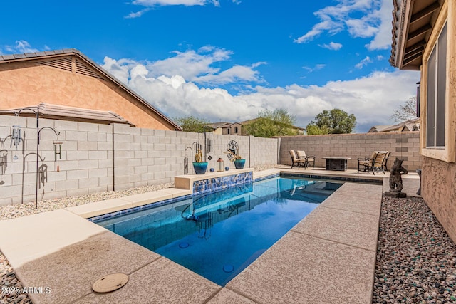 view of pool with a patio area, a fenced backyard, and a fenced in pool