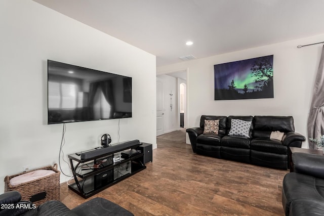 living area featuring wood finished floors, visible vents, and recessed lighting