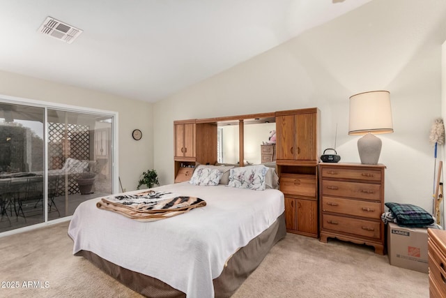 bedroom with lofted ceiling, access to exterior, and light carpet