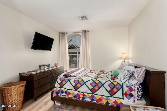 bedroom with light hardwood / wood-style floors