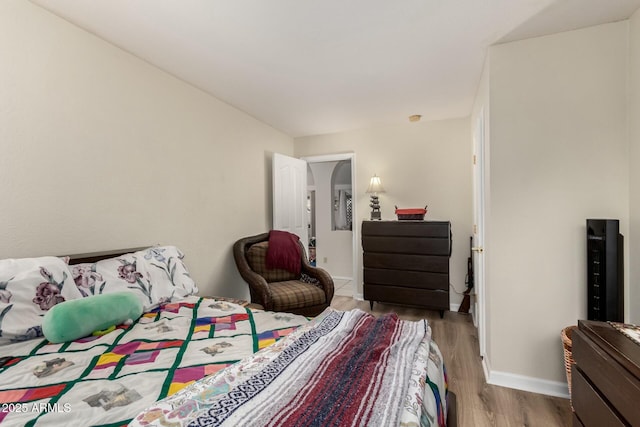 bedroom with light wood-type flooring