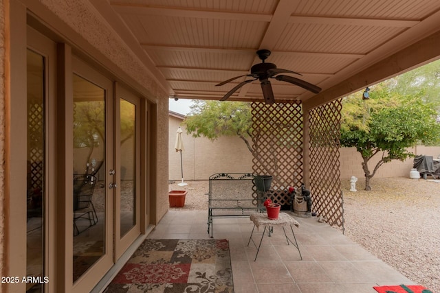 view of patio featuring french doors and ceiling fan