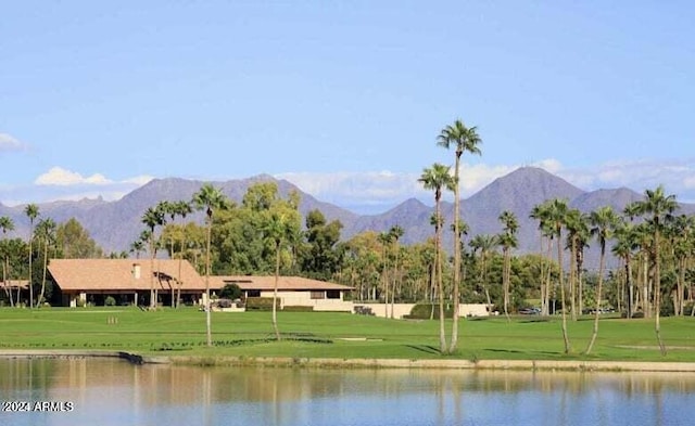 surrounding community with a yard and a water and mountain view