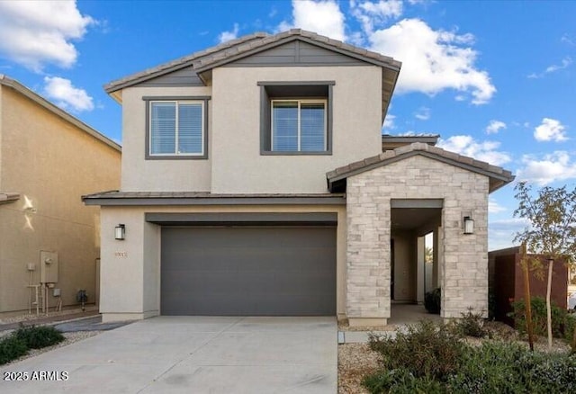 10013 E Trent Ave, Mesa, AZ 85212 - view of front facade featuring an attached garage, driveway, stone siding, and stucco siding