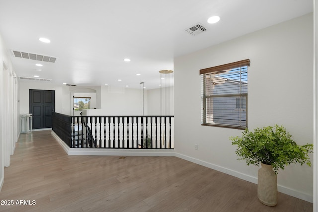 4960 E Colonial Dr, Chandler, AZ 85249 - corridor with light wood finished floors, baseboards, and recessed lighting