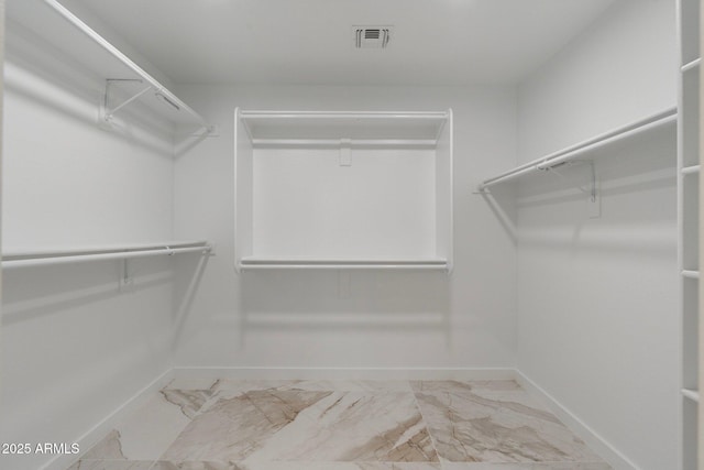 4960 E Colonial Dr, Chandler, AZ 85249 - spacious closet featuring marble finish flooring