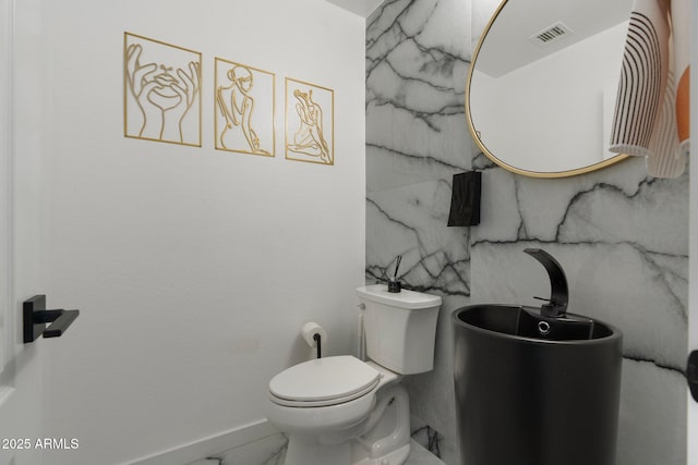 4960 E Colonial Dr, Chandler, AZ 85249 - bathroom featuring toilet, marble finish flooring, and baseboards