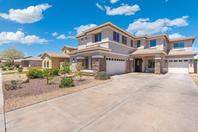 4960 E Colonial Dr, Chandler, AZ 85249 - view of front facade featuring an attached garage, stucco siding, driveway, and stone siding