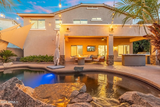4960 E Colonial Dr, Chandler, AZ 85249 - rear view of property with an outdoor living space, a patio, stucco siding, and an outdoor pool