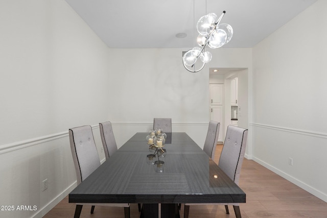 4960 E Colonial Dr, Chandler, AZ 85249 - dining area featuring a chandelier, light wood-type flooring, and baseboards