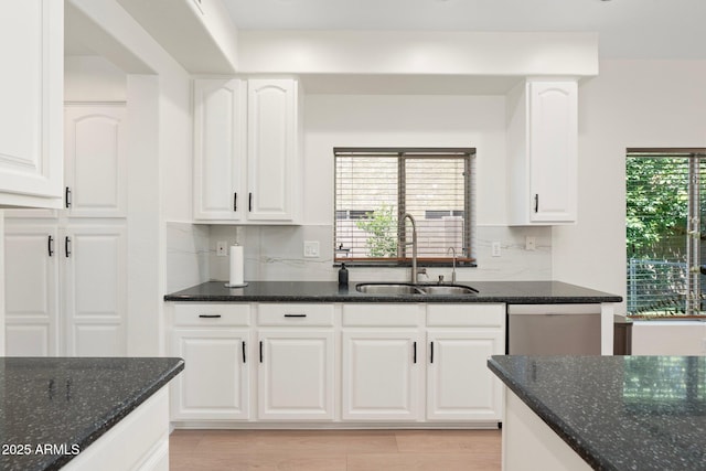 4960 E Colonial Dr, Chandler, AZ 85249 - kitchen with a sink, dark stone countertops, decorative backsplash, and white cabinets