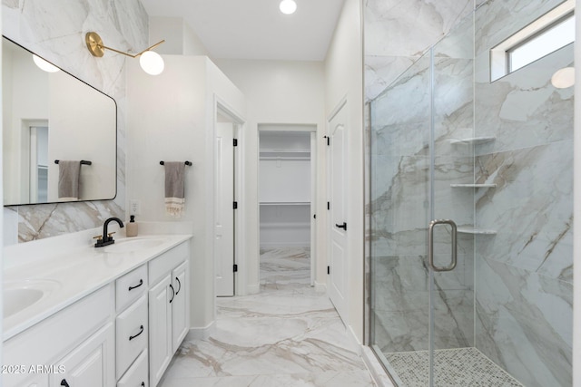 4960 E Colonial Dr, Chandler, AZ 85249 - full bath with marble tiled floors, double vanity, a marble finish shower, and a walk in closet