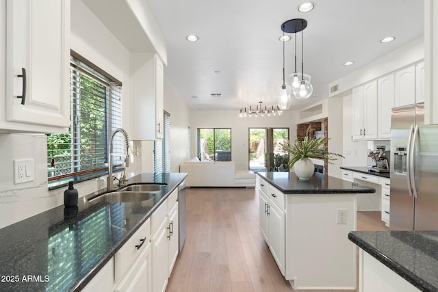 4960 E Colonial Dr, Chandler, AZ 85249 - kitchen with stainless steel appliances, a sink, healthy amount of natural light, open floor plan, and recessed lighting