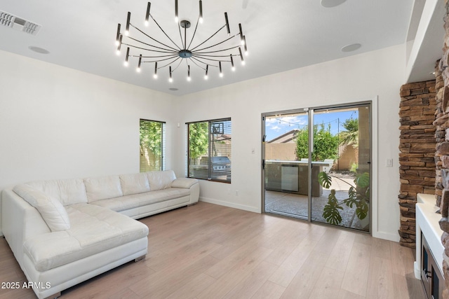 4960 E Colonial Dr, Chandler, AZ 85249 - living area with light wood-style flooring, baseboards, track lighting, and a chandelier