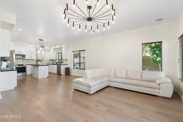 4960 E Colonial Dr, Chandler, AZ 85249 - living area with light wood-style floors, recessed lighting, and baseboards