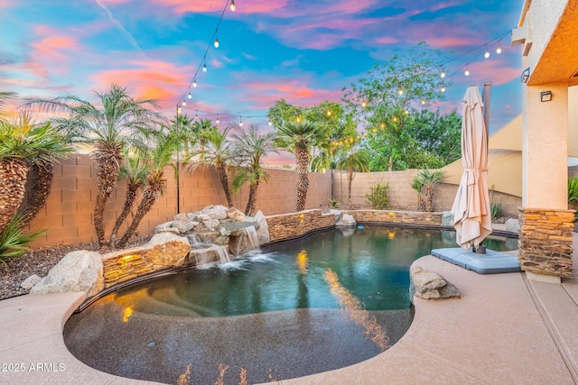 4960 E Colonial Dr, Chandler, AZ 85249 - pool at dusk featuring a fenced backyard